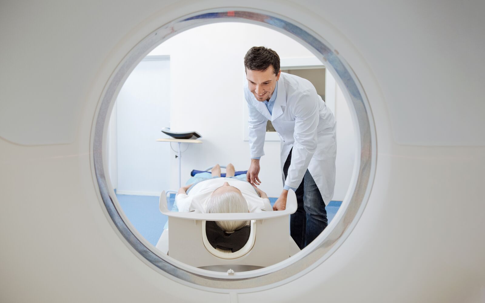 Positive happy doctor looking at his patient